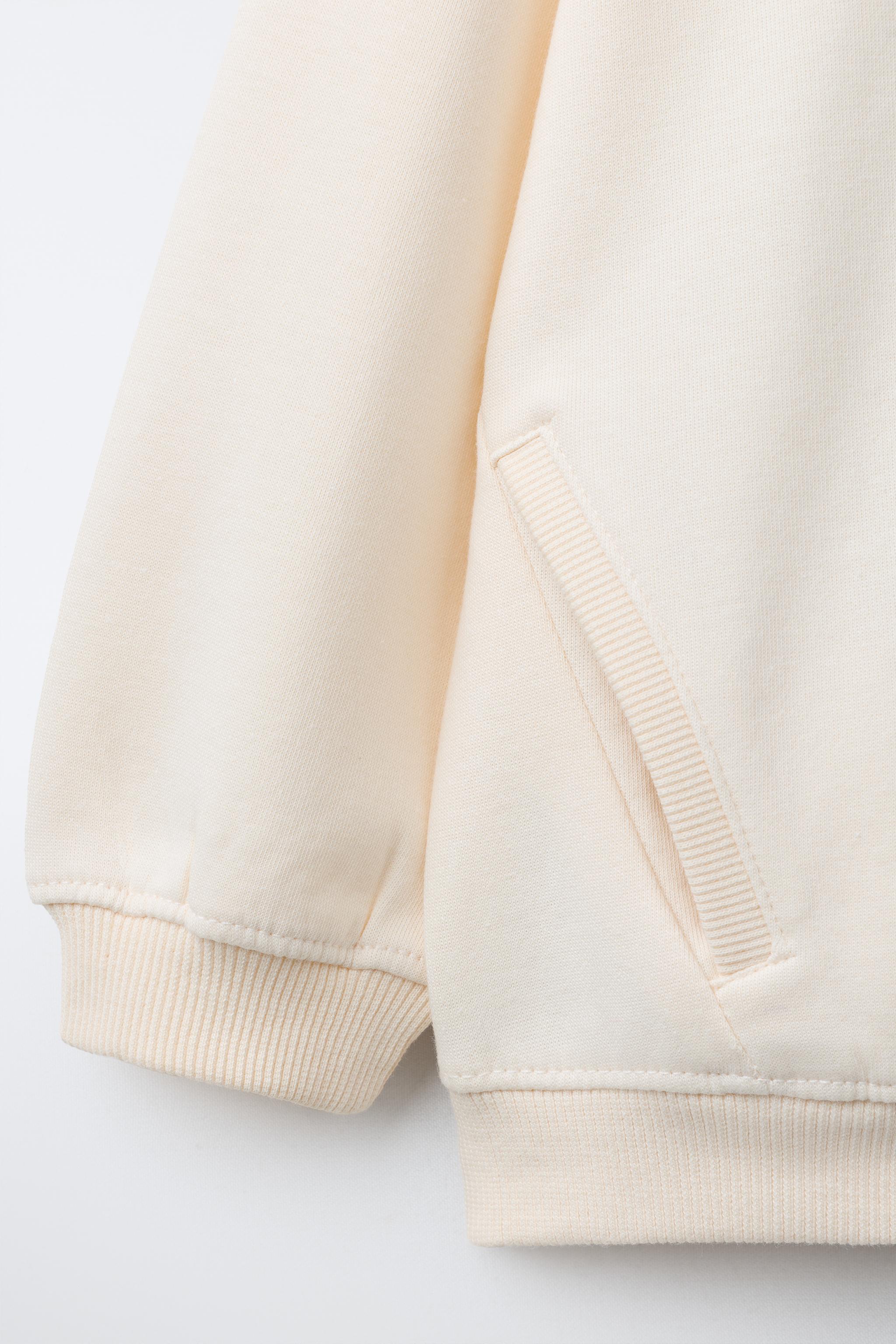 INTERLOCK ZIP SWEATSHIRT WITH RAISED TEXT